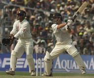15 Mar 2001:  Steve Waugh of Australia hits out with substitute wicketkeeper Rahul Dravid of India looking on, during day five of the 2nd Test between India and Australia played at Eden Gardens, Calcutta, India. X DIGITAL IMAGE  Mandatory Credit: HamishBlair/ALLSPORT